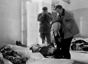 A dead teenage girl is carried into the morgue at Sarajevo's Kosevo hospital on December 6, 1993.