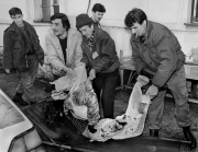 A dead teenage girl is carried into the morgue at Sarajevo's Kosevo hospital on December 6, 1993.