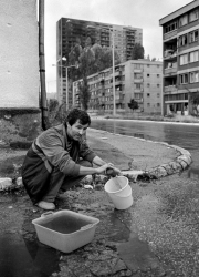 A dead teenage girl is carried into the morgue at Sarajevo's Kosevo hospital on December 6, 1993.