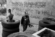 A dead teenage girl is carried into the morgue at Sarajevo's Kosevo hospital on December 6, 1993.